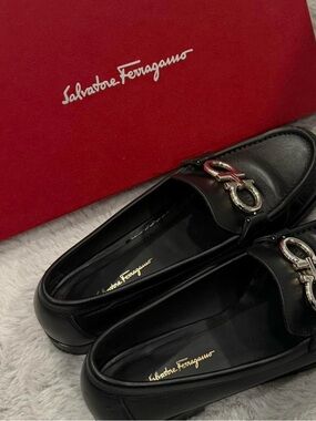 Salvatore Ferragamo Black Leather Rolo Loafers with mixed metal hardware
